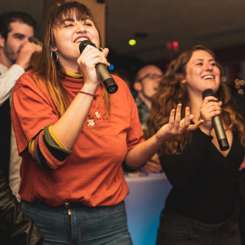 two girls with microphine singing