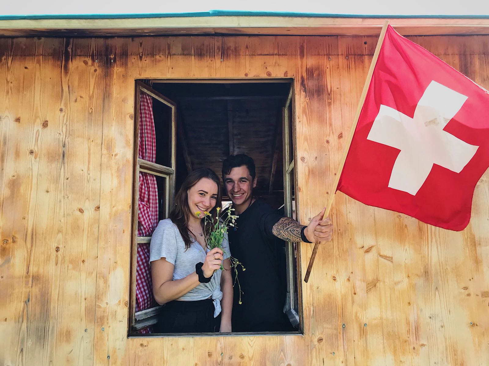 friend with a flags wooden chalet